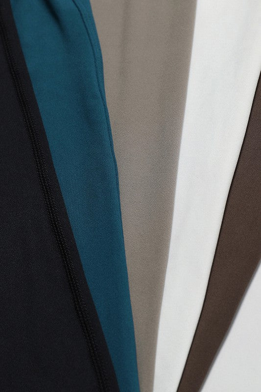 Fitted Sleeveless Jumpsuit with Flared Trousers and a Cutout Back Trendy Activewear Outfit Idea for Women | Ro + Ivy