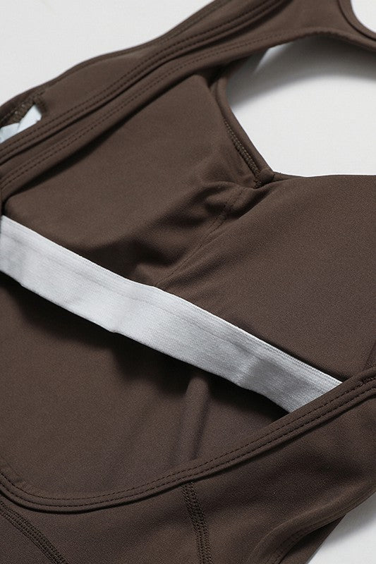 Fitted Sleeveless Jumpsuit with Flared Trousers and a Cutout Back Trendy Activewear Outfit Idea for Women | Ro + Ivy