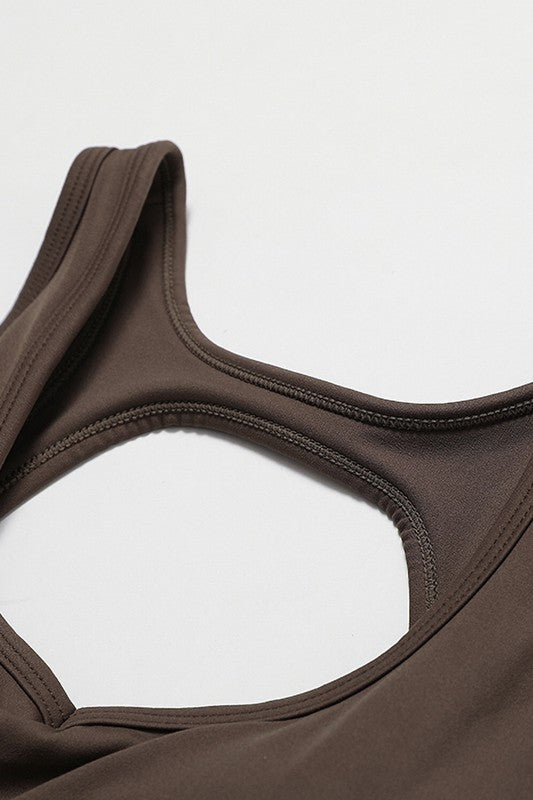 Fitted Sleeveless Jumpsuit with Flared Trousers and a Cutout Back Trendy Activewear Outfit Idea for Women | Ro + Ivy