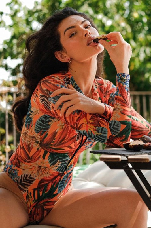 Orange Floral Long Sleeve Rash Guard Swimsuit With Front Zip & UPF 50+ Trendy One-Piece Swimsuits Outfit Idea for Women | Ro + Ivy