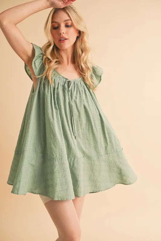 Ruffled Cap Sleeve Cotton Tunic Mini Dress in Green – outfit idea for women | Ro + Ivy