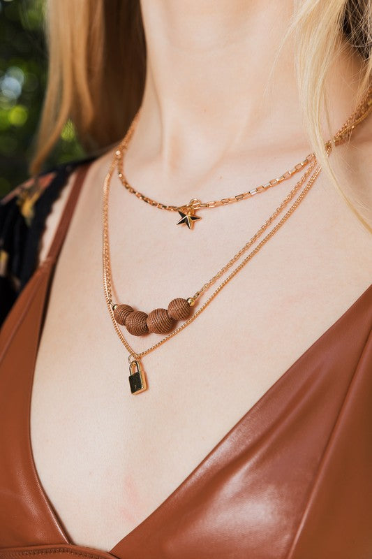 Three Layered Rustic Gold Charmed Necklace | Trendy Necklaces Outfit Idea for Women by Ro + Ivy | Elevated Basics, Modern Comfort & Style