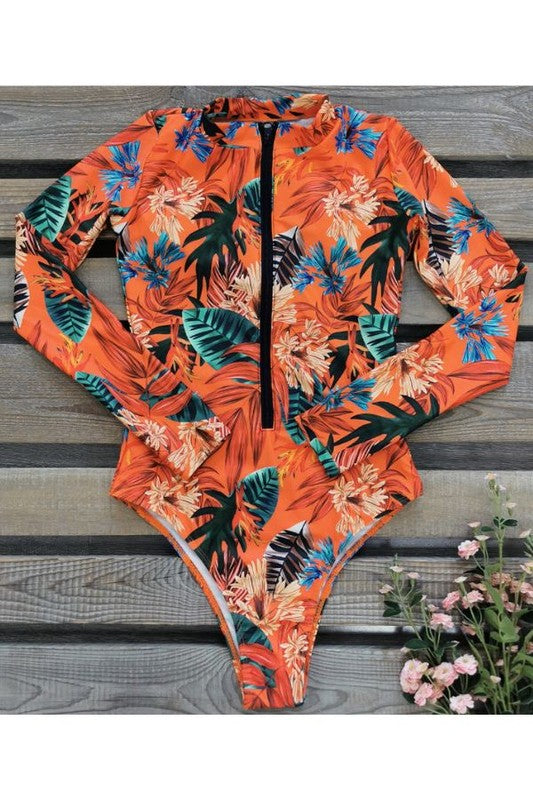 Orange Floral Long Sleeve Rash Guard Swimsuit With Front Zip & UPF 50+ Trendy One-Piece Swimsuits Outfit Idea for Women | Ro + Ivy