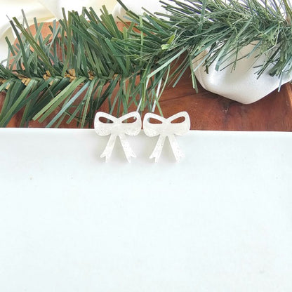 White Shimmer OneSize White Christmas Bow Stud Earrings | Trendy Earrings Outfit Idea for Women by Ro + Ivy | Elevated Basics, Modern Comfort & Style