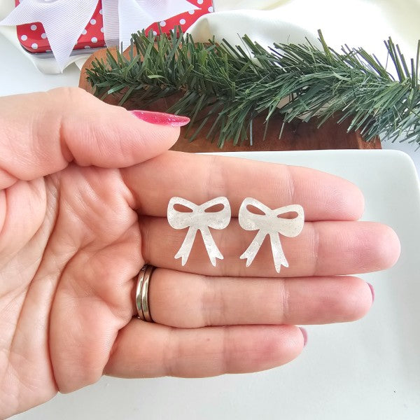 White Christmas Bow Stud Earrings | Trendy Earrings Outfit Idea for Women by Ro + Ivy | Elevated Basics, Modern Comfort & Style