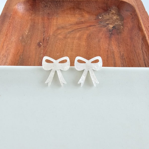 White Christmas Bow Stud Earrings | Trendy Earrings Outfit Idea for Women by Ro + Ivy | Elevated Basics, Modern Comfort & Style