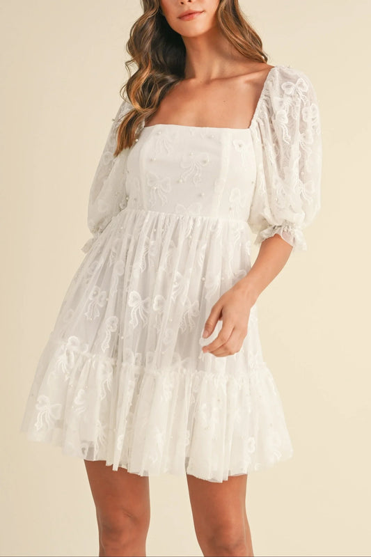 Vestido de malla con lazo de Jacquard y detalle de perlas