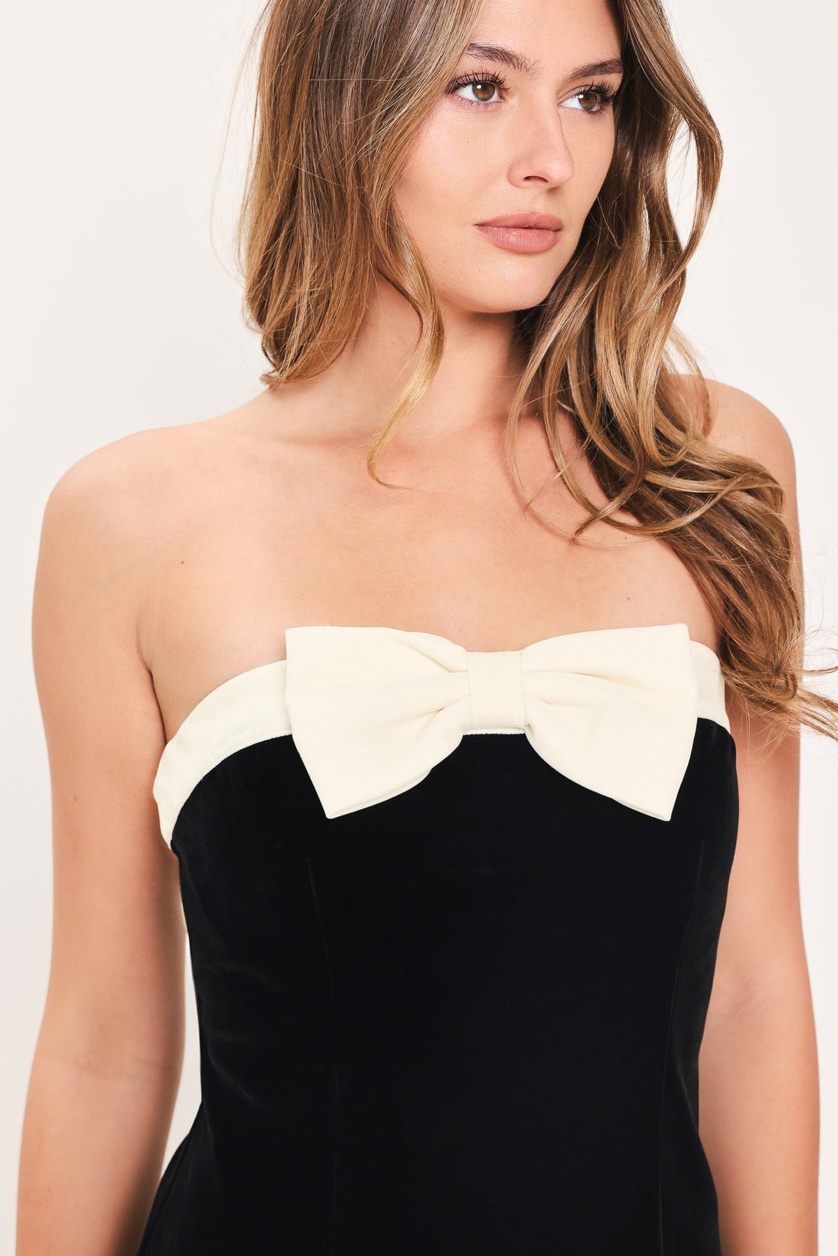 Black Velvet Strapless Mini Dress with Contrasting Ivory Bow Detail