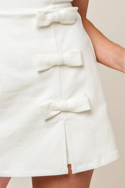 Minimalist Round Neck Sleeveless Cotton Skort Romper with Side Bows | Trendy Rompers Outfit Idea for Women by Ro + Ivy | Elevated Basics, Modern Comfort & Style