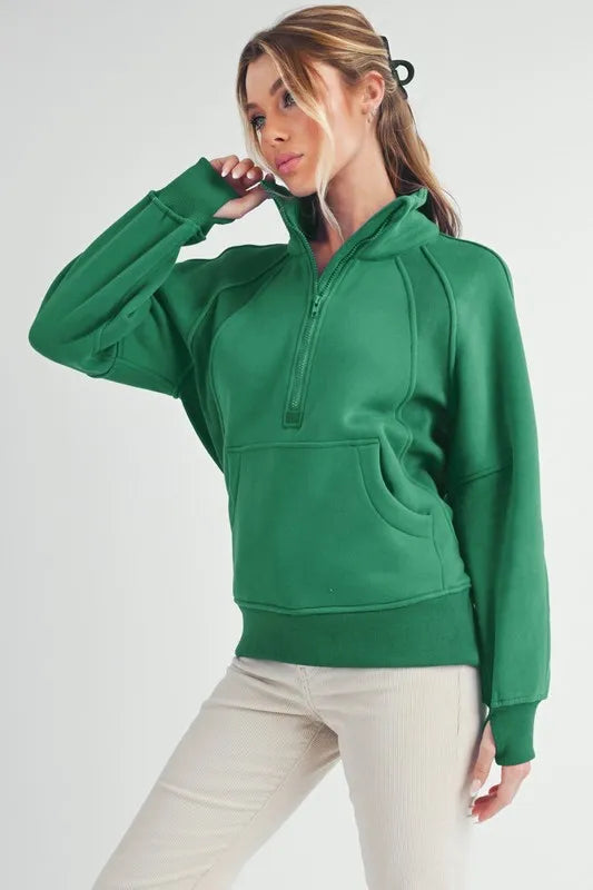 Half-Zip Raglan Sleeve Kangaroo Pocket Sweatshirt in Lily Pad | Trendy Sweatshirts Outfit Idea for Women by Ro + Ivy | Elevated Basics, Modern Comfort & Style