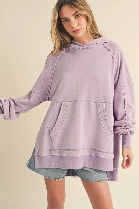 Lilac Exposed Seam Side Slit Kangaroo Pocket Hoodie | Trendy Pullover Hoodies Outfit Idea for Women by Ro + Ivy | Elevated Basics, Modern Comfort & Style