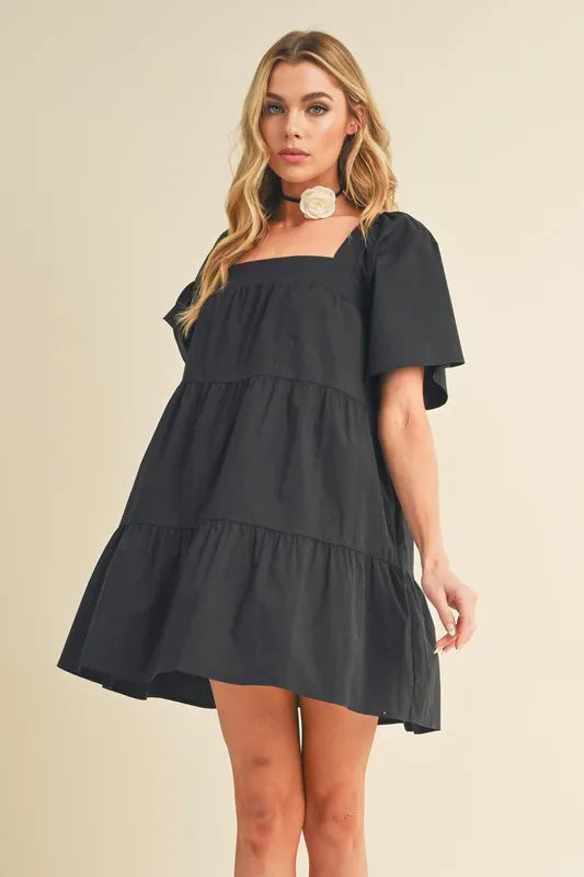 Black Square Neck Short Sleeve Tiered Mini Dress | Trendy Mini Dresses Outfit Idea for Women by Ro + Ivy | Elevated Basics, Modern Comfort & Style